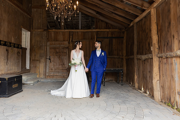 Bride and groom hand in hand at Falkirk Estate