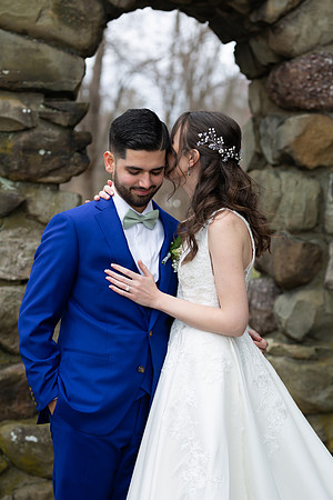 Bride whispering to Grooms ear at Falkirk Estate